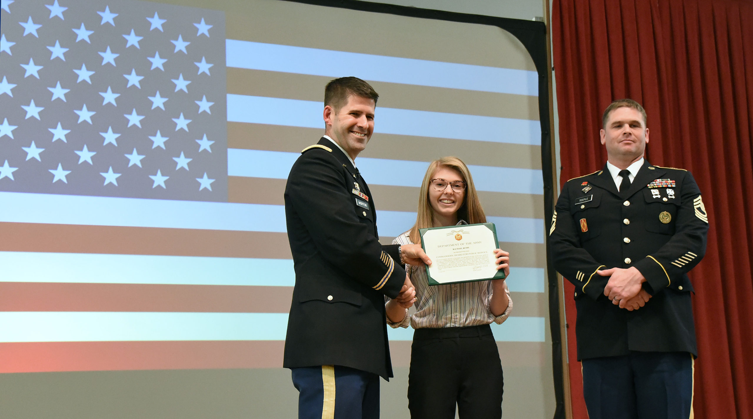 Rachael Rudis receives the Department of the Army's Commander Award for Public Service for her student organization Ship Stands with America's Military.